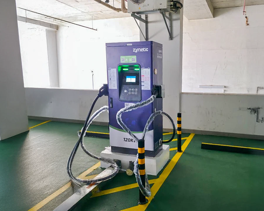Zynetic 120 kW charger in a covered indoor bay